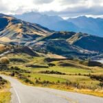 Nelson car rental parked at a scenic coastal viewpoint overlooking Tasman Bay